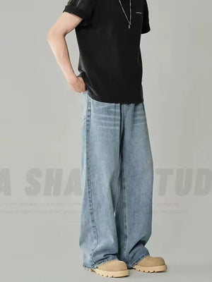 Men's light wash oversized jeans with a relaxed fit and wide leg.