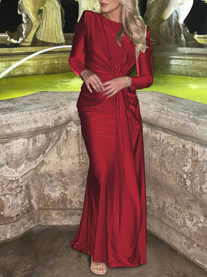 Red ruched knot front maxi dress with long sleeves and a draped skirt.