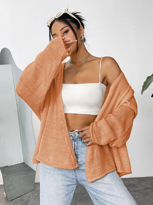 Open-front slouchy knit cardigan in sherbet acrylic with relaxed sleeves.
