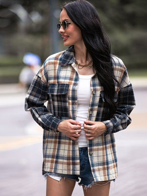 Colorblock plaid utility shacket in navy with button front and chest pockets.