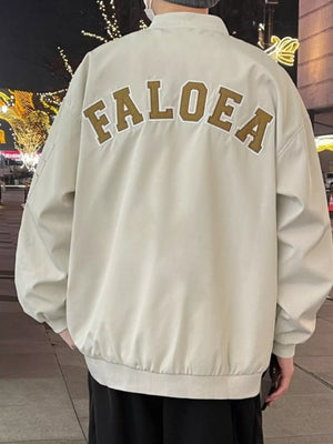 Apricot bomber jacket with "FALOE A" embroidered on the back.