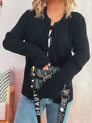 Black ribbed tie-front cardigan with cuffed sleeves and a round neckline.