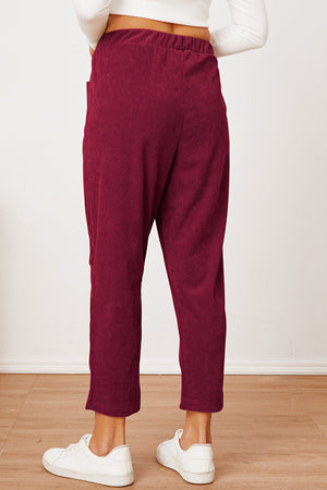Corduroy barrel-leg utility pants in Scarlet with elastic waist and pockets.