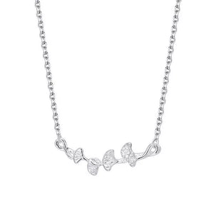 Silver necklace with a delicate ginkgo leaf branch design.