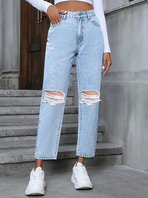 Light wash distressed boyfriend jeans with ripped knees and a bow detail.