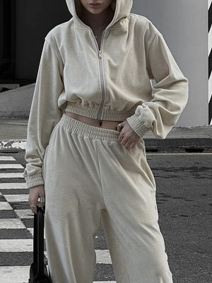 Apricot cropped zip hoodie and wide leg sweatpants set with elastic waistband and cuffs.