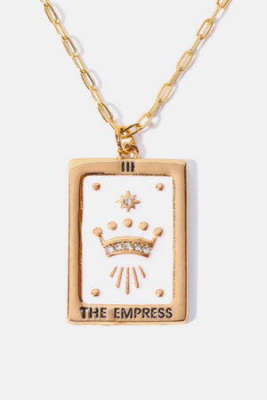 Gold tarot card pendant necklace with white enamel, crown, and crystals.