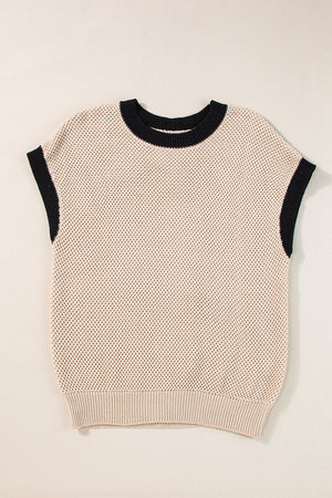 Beige knit cap sleeve top with black trim neckline and armholes.