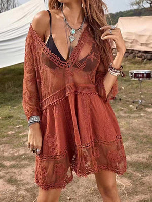 Bohemian lace tiered mini dress in rust with a deep V-neck and long sleeves.