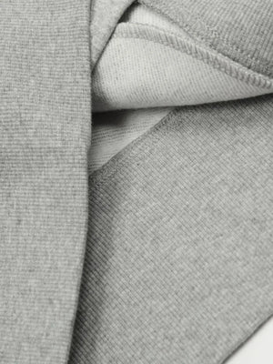 Gray zip-up sweatshirt with sculpted seam detail and ribbed texture.