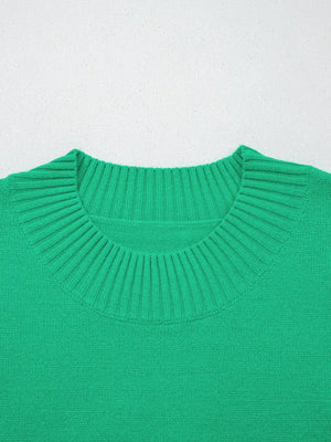 Green ribbed knit top with ruffled round neck