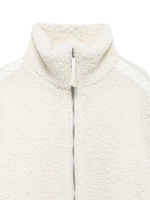 White teddy fleece zip-up jacket with contrast piping detail and stand-up collar.