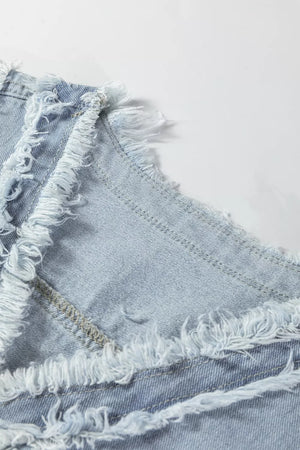Light wash denim vest with frayed edges and visible stitching details.