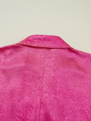 Lustrous collared V-neck maternity shirt in deep rose polyester with a textured finish.