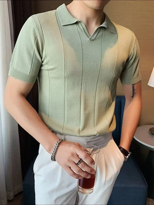 Sage green knit polo shirt with vertical ribbing and short sleeves.
