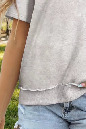Light grey cotton blend oversized t-shirt with lettuce hem detail.