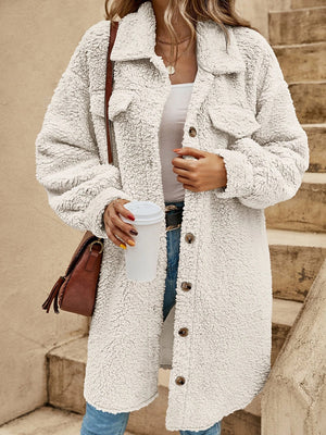 White teddy bear shacket with oversized button-down front and chest pockets.