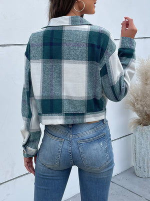 Green and white plaid shacket with buttoned cuffs and collar.