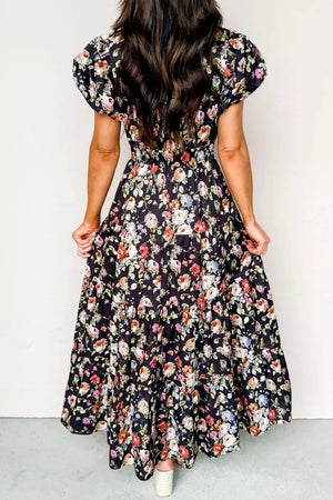 Floral tiered maxi dress with smocked waist and short sleeves.