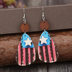 Patriotic wood teardrop earrings with American flag design and white stars.