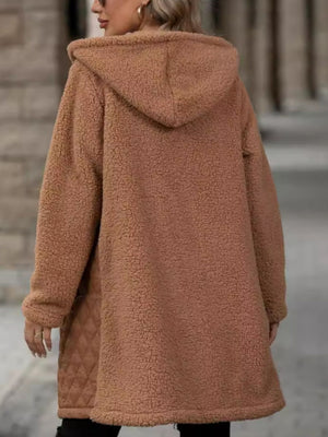 Caramel teddy coat with quilted side panels and hood.