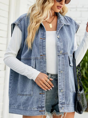 Light Blue denim vest with button-down front, collar, and pockets. Relaxed fit.