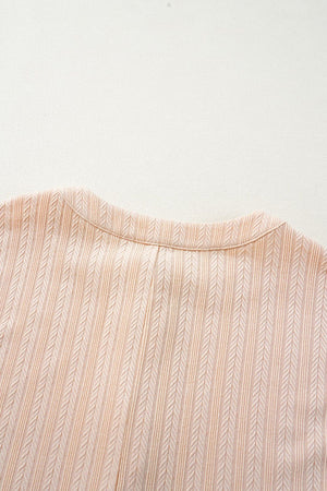 Textured ribbed sleeveless collar jumpsuit in eggshell with a button detail.