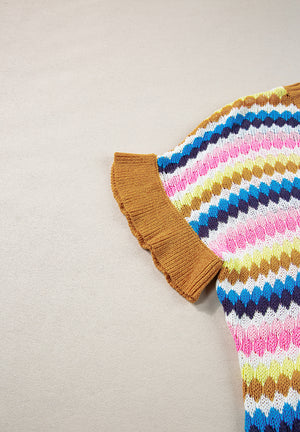 Textured knit sweater with multicolor chevron stripes and contrast trim sleeves.