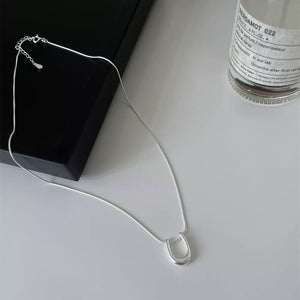 Sterling silver U-shaped pendant necklace with a delicate snake chain.