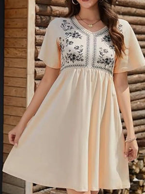 Embroidered floral v-neck mini dress in cream with flutter sleeves and a gathered waist.