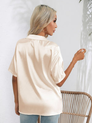Tan satin collared shirt with short sleeves and a tie-front detail.