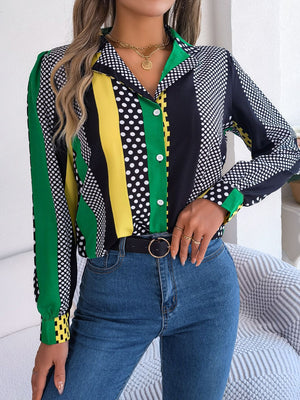 Collared blouse with bold color block and polka dot print, long sleeves, button front.
