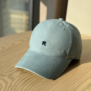 Light blue baseball cap with embroidered R detail and adjustable strap