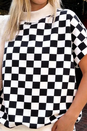 Black and white checkerboard bikini top with a mock neck.