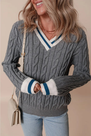 Dark gray cable knit sweater with v-neck and varsity stripe trim on collar and cuffs.