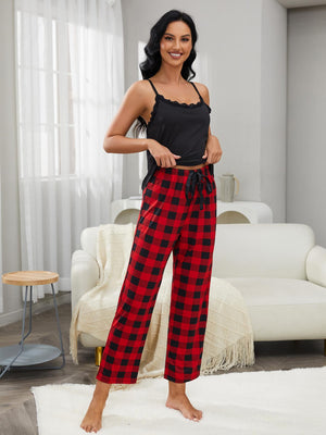 Black lace trim camisole and red buffalo check pajama pants with drawstring waist