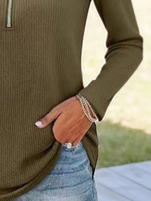 Ribbed knit half-zip sweater in army green with silver zipper detail.