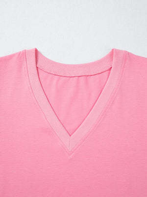 Pink cotton v-neck blouse with ribbed neckline detail