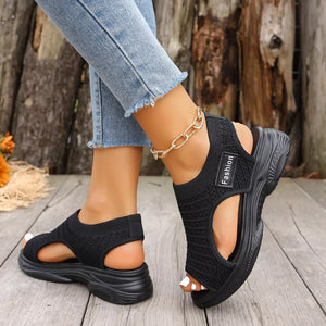 Black chunky platform sandals with breathable knit upper and "Fashion" label detail.