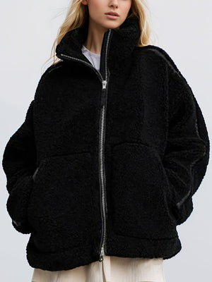 Black teddy fleece zip-up jacket with contrast piping and a high collar.