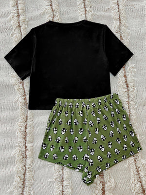 Black short sleeve tee and green panda print shorts pajama set.