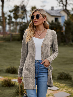 Longline ribbed knit button-down cardigan in beige with pockets and a relaxed fit.