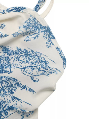 Charming floral tie-front cami top in white with blue toile print and adjustable straps.