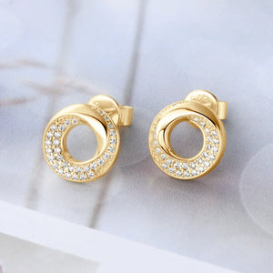 Gold pavé circle stud earrings with delicate cubic zirconia accents.