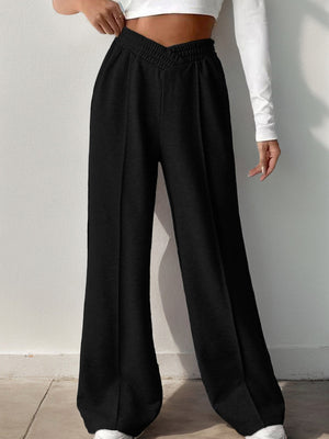 Black V-waistline palazzo sweatpants with center seams and wide leg