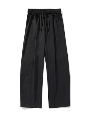 Black balloon-fit drawstring trousers with a relaxed casual style.