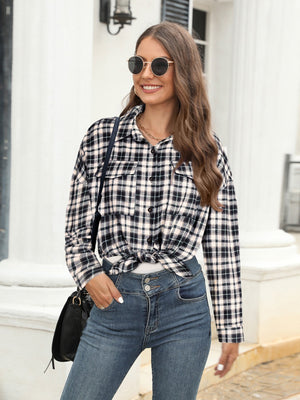 Black plaid button-up shirt with two chest pockets, tied at the waist