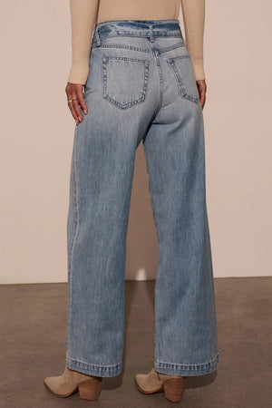 Belted wide-leg denim trousers in medium wash, shown from the back with a casual fit.