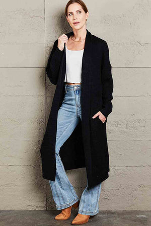 Black textured knit maxi cardigan with pockets and an open front.