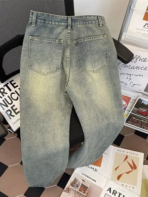 Classic plus size vintage wash jeans in medium blue denim with a relaxed fit and distressed details.